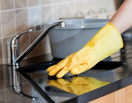 Cleaner maintaining a shared staircase in Maida Vale