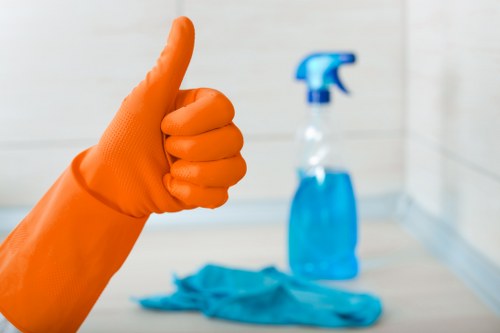 Cleaner treating stains on a living room sofa in a Maida Vale property